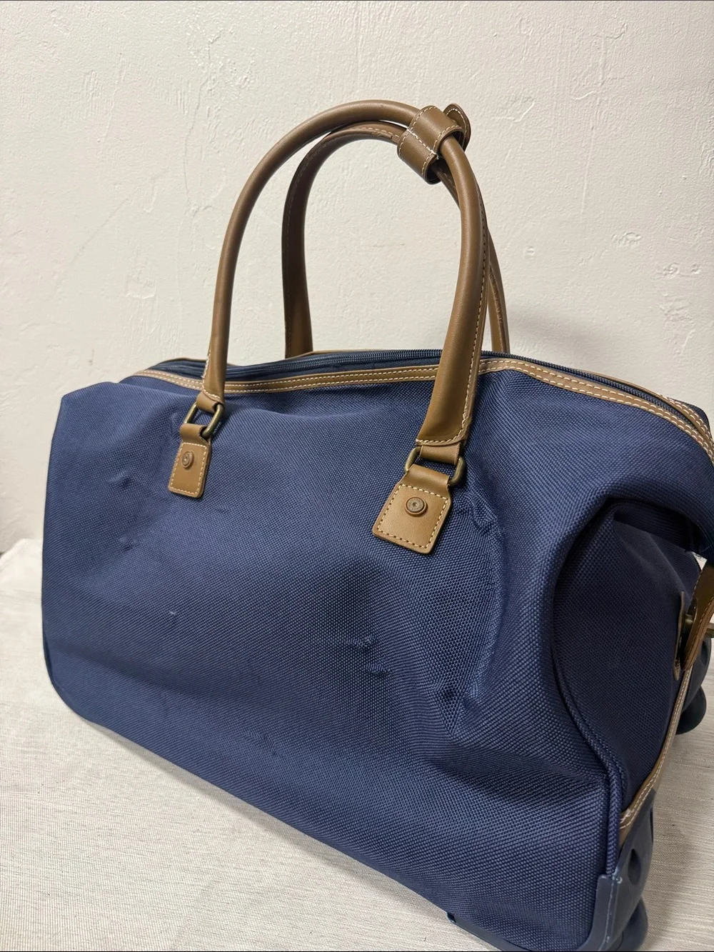 Tommy Hilfiger Navy rolling Duffel with Red & White Center Stripe  carry on